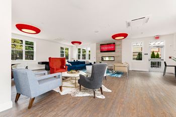 Community room with entertainment kitchen, work area, tv and fireplace